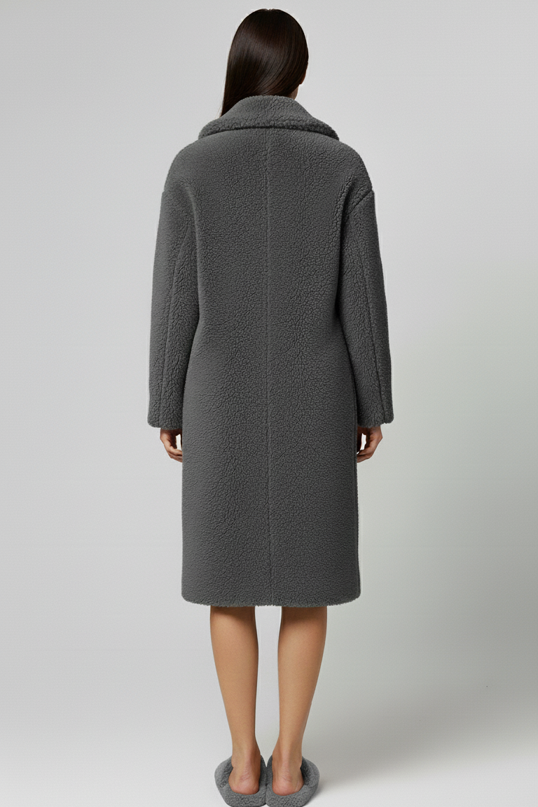 Person wearing a gray coat from behind on a white background