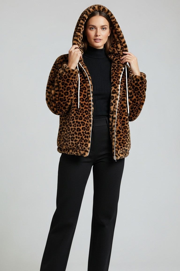 Person wearing a leopard print hoodie with a plain background