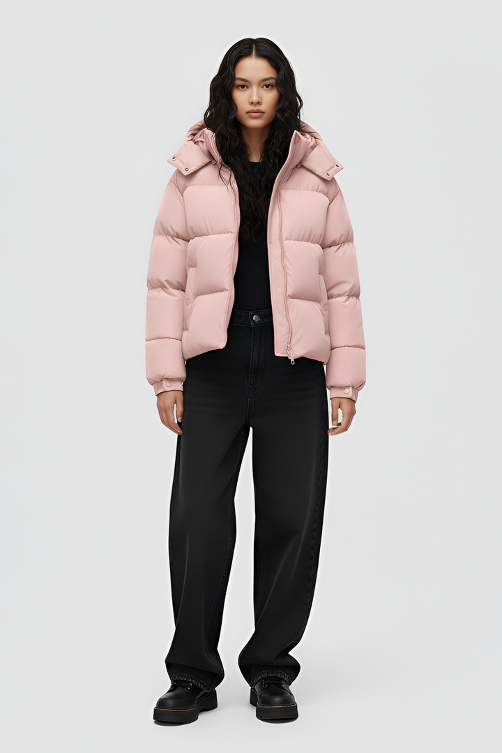 Pink puffer jacket with a hood on a white background