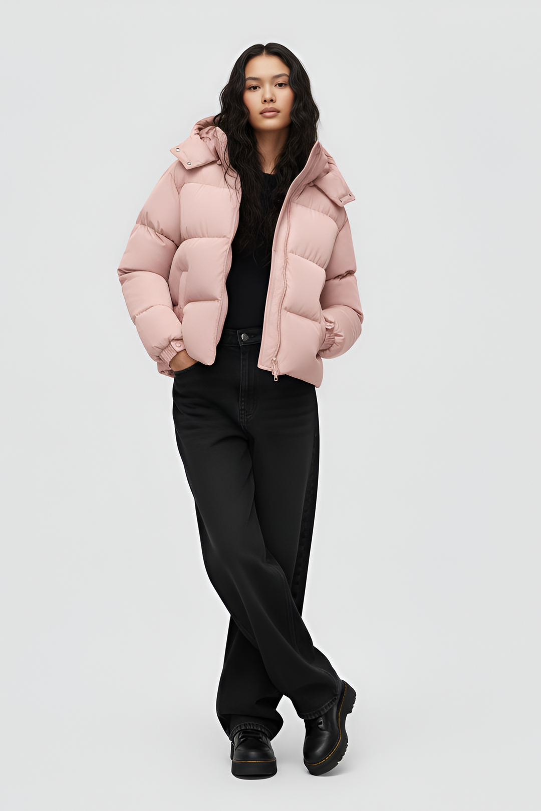 Pink puffer jacket with a hood on a white background