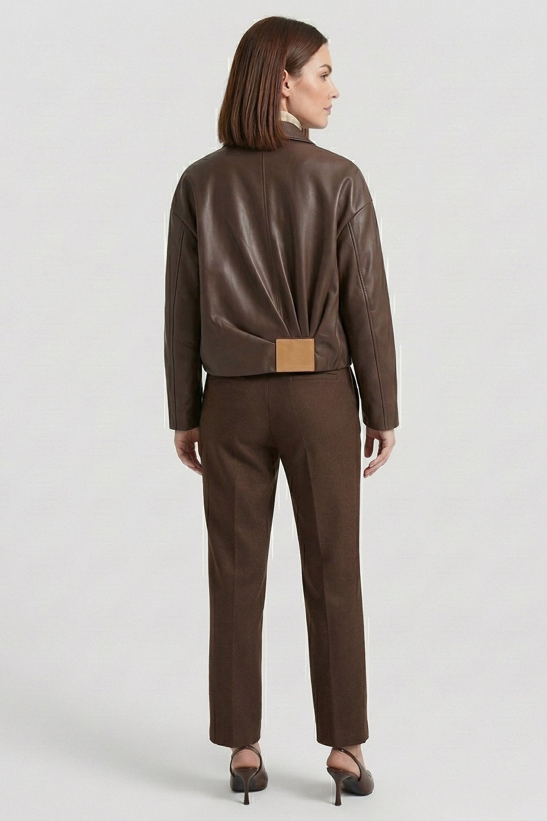 REESE - Back view, detail of leather jacket with buckle