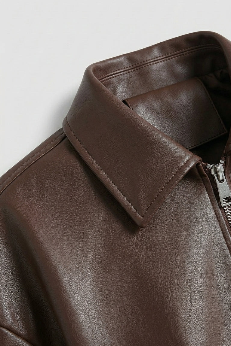 REESE - Close-up of leather jacket collar and zipper
