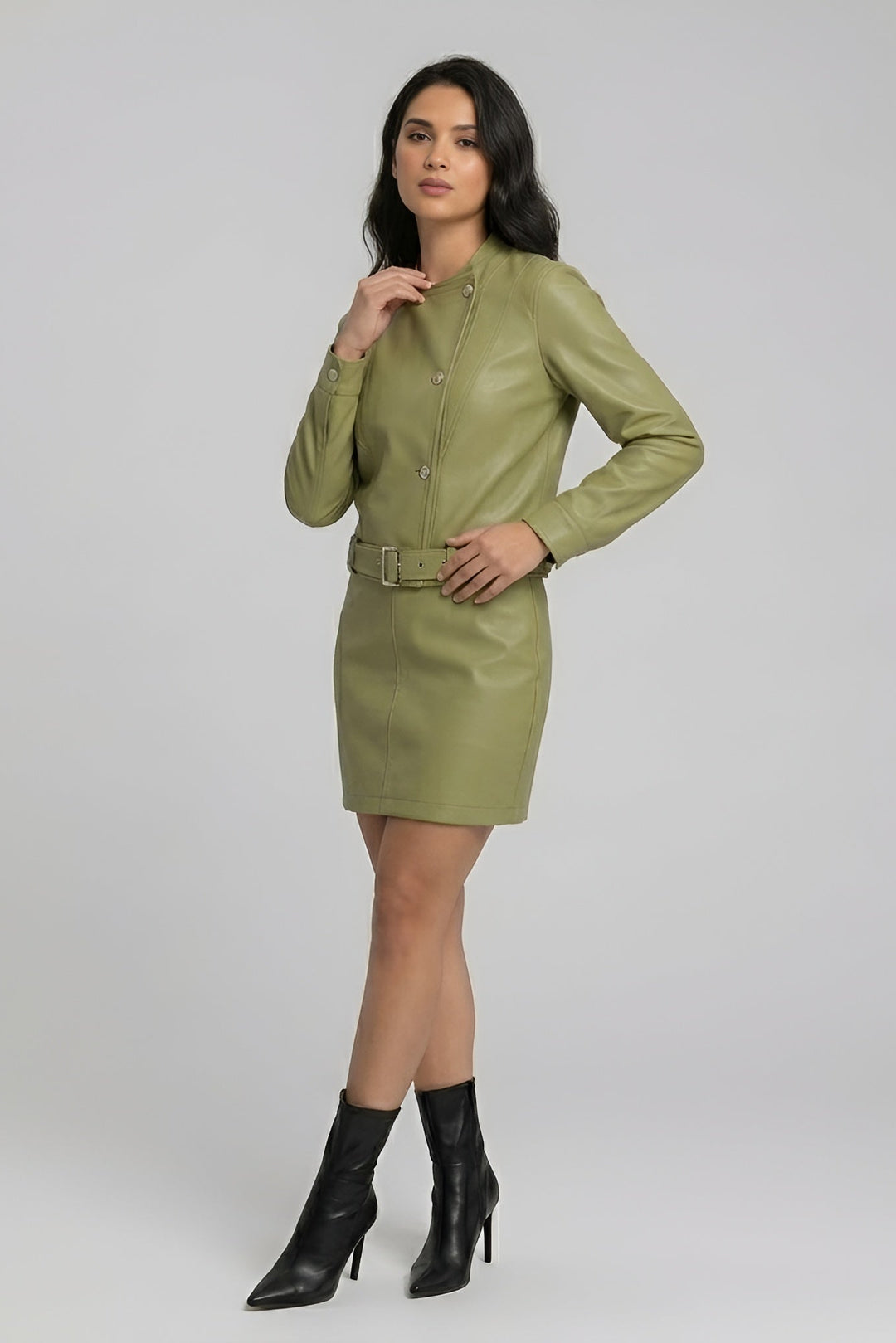 ROWYN - Woman in olive leather dress, hand on hip, fashion photography