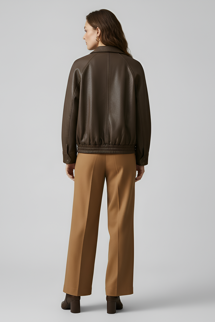 SCARLETT - Woman wearing brown leather bomber jacket from behind