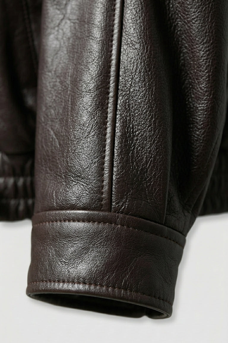 Billie - Oversize Bubble Jacket, black leather, belted hem detail, close-up