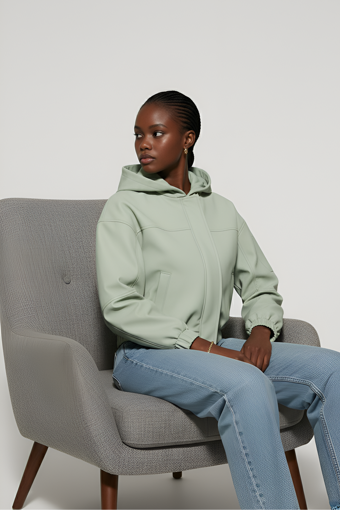 Side angle of MAERIS lightweight hooded trench coat highlighting the short length and woven texture.