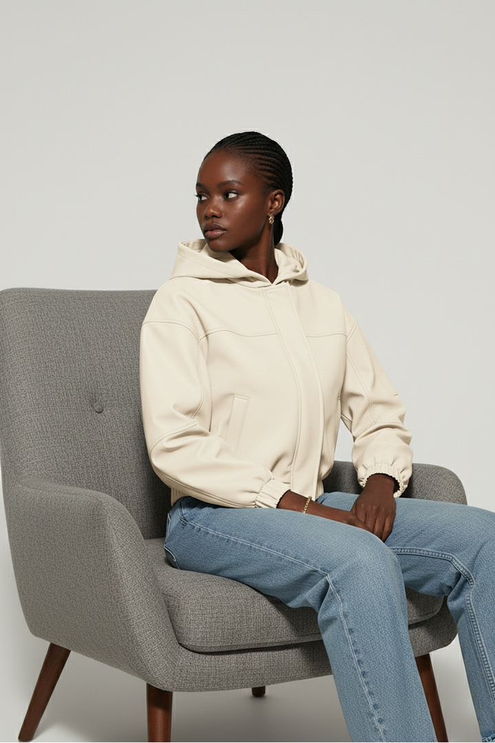 Side angle of MAERIS lightweight hooded trench coat Beige highlighting the short length and woven texture.