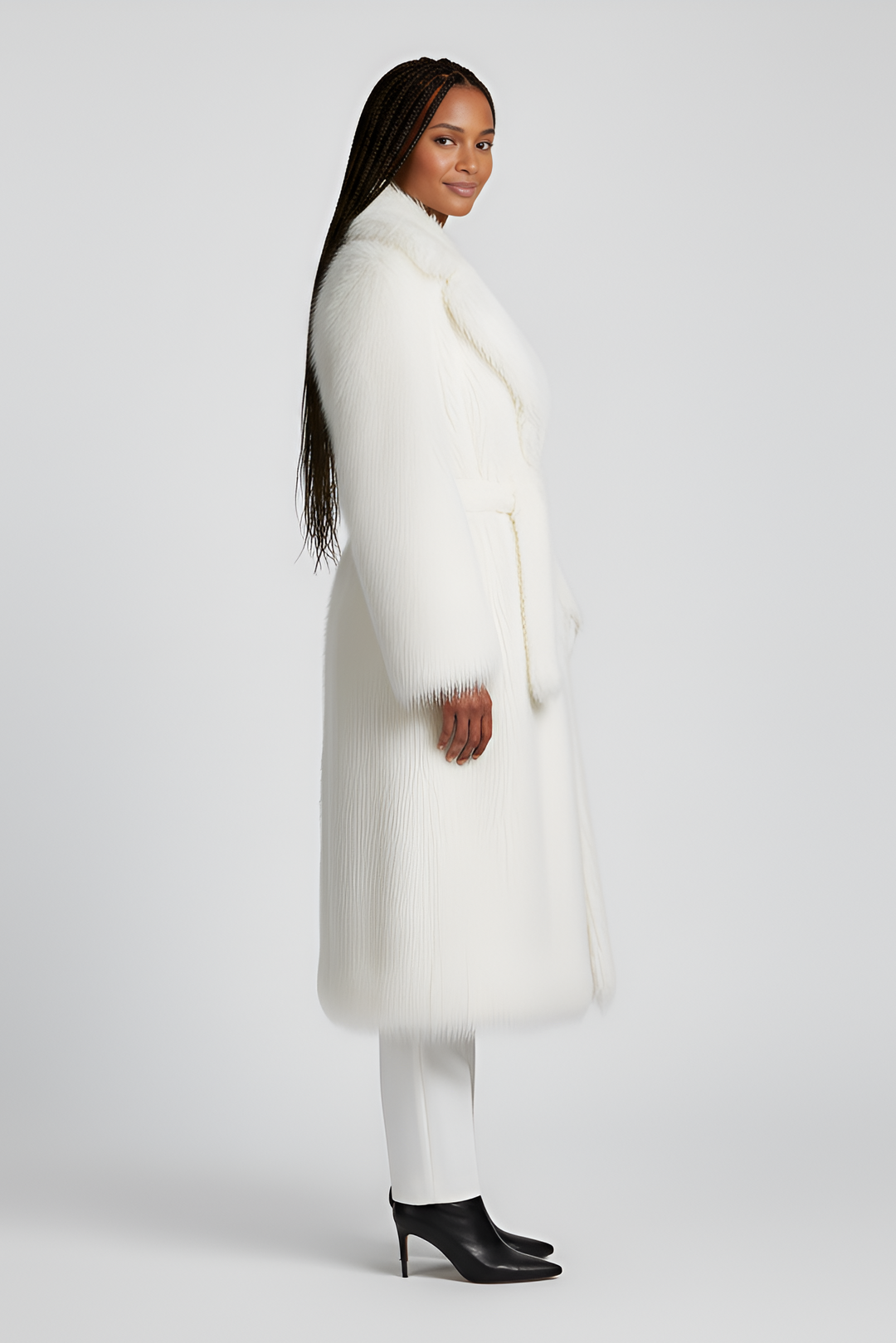 Side angle of the MARZELA long fur coat highlighting its elegant silhouette.