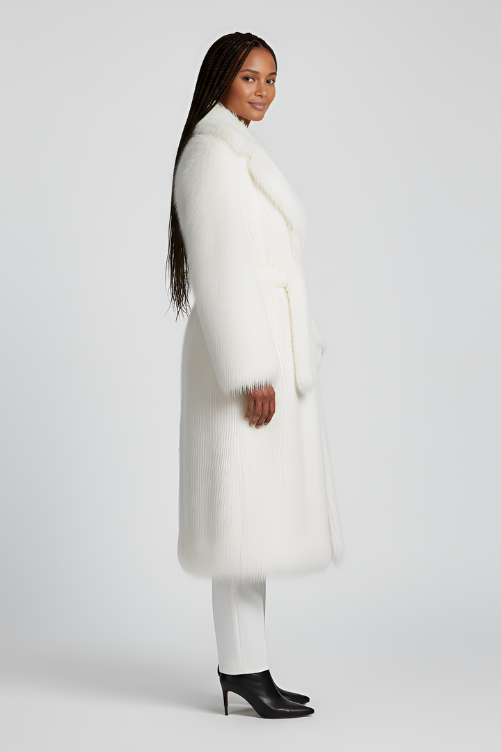Side angle of the MARZELA long fur coat highlighting its elegant silhouette.