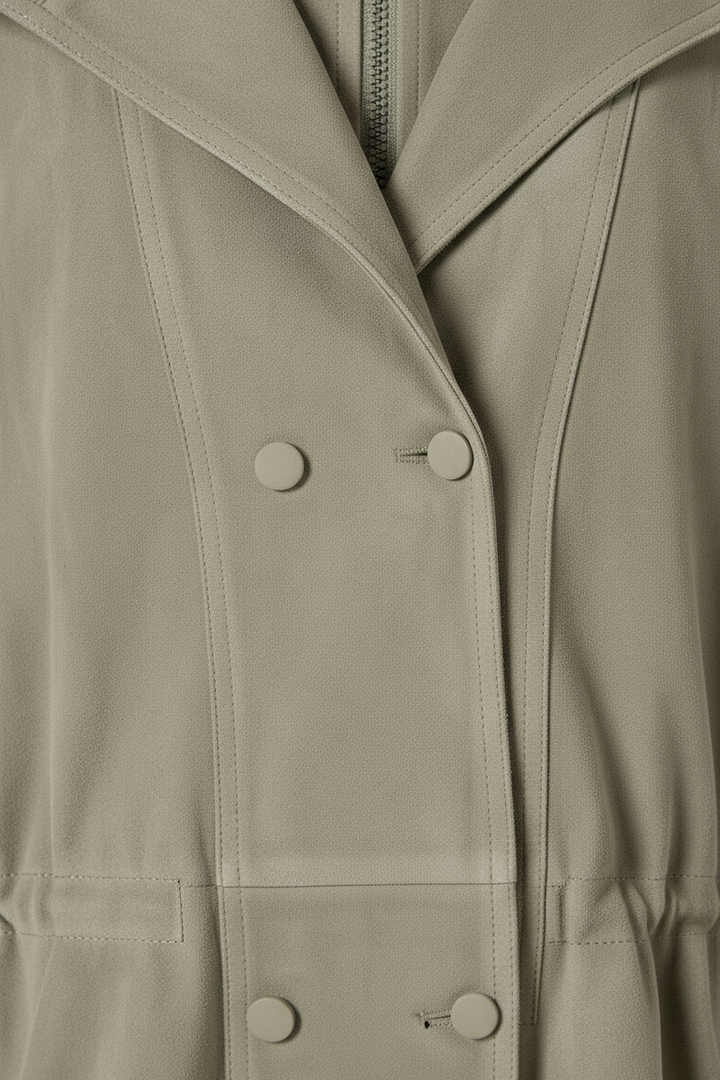TESSA - Close-up of sage green bomber jacket button view