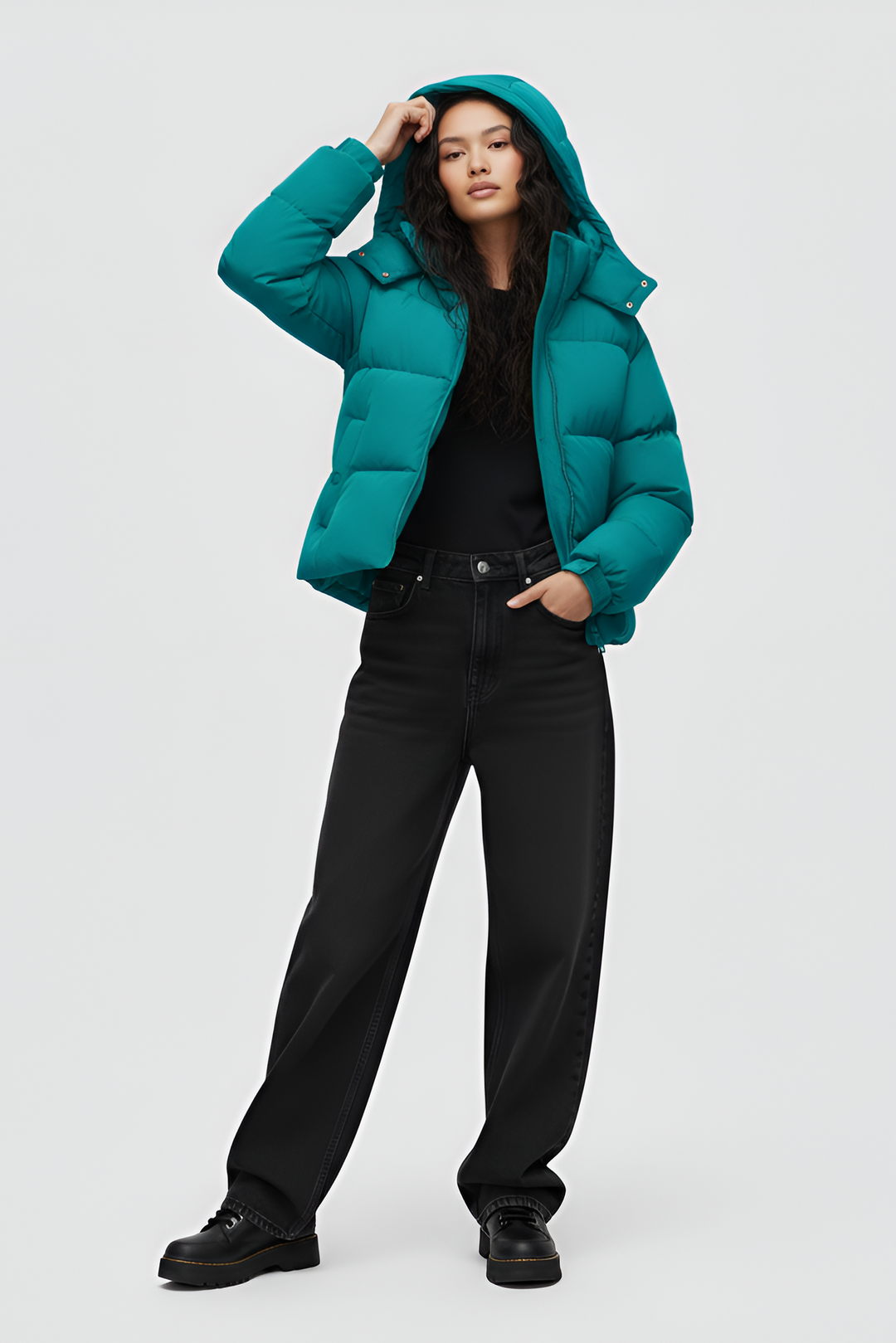 Teal puffer jacket with a hood on a white background