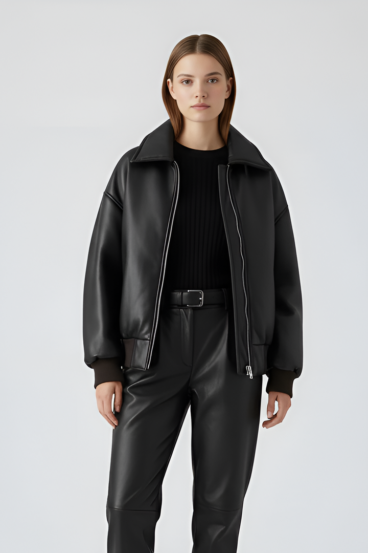 The oversized faux leather cropped jacket redefines modern winter style with bold softness and sculpted volume