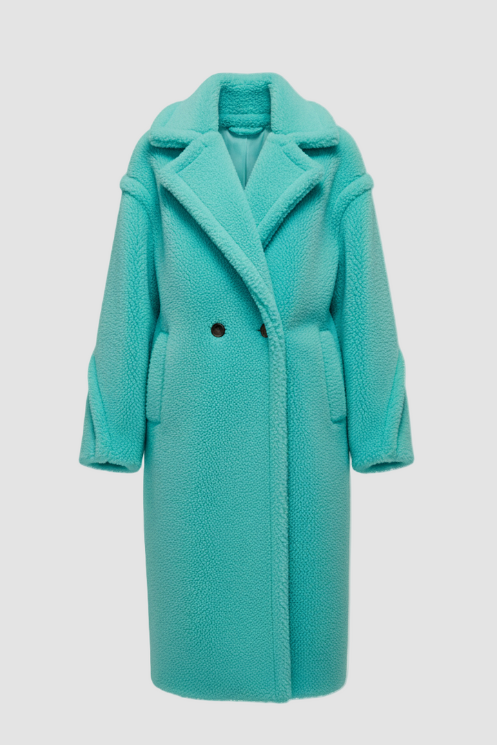 Turquoise coat on a light gray background