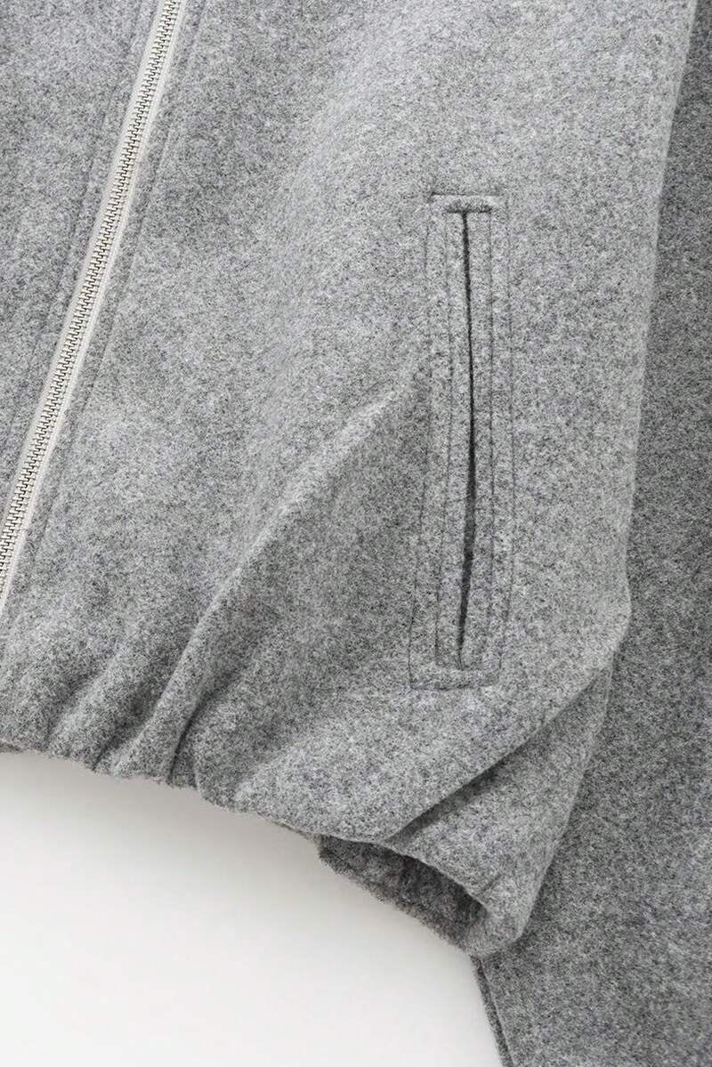 Model styling VALERINE Velvet Bomber Jacket for a casual autumn-winter street look.