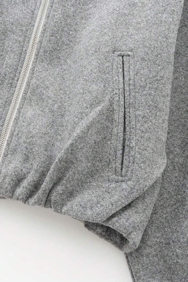 Model styling VALERINE Velvet Bomber Jacket for a casual autumn-winter street look.