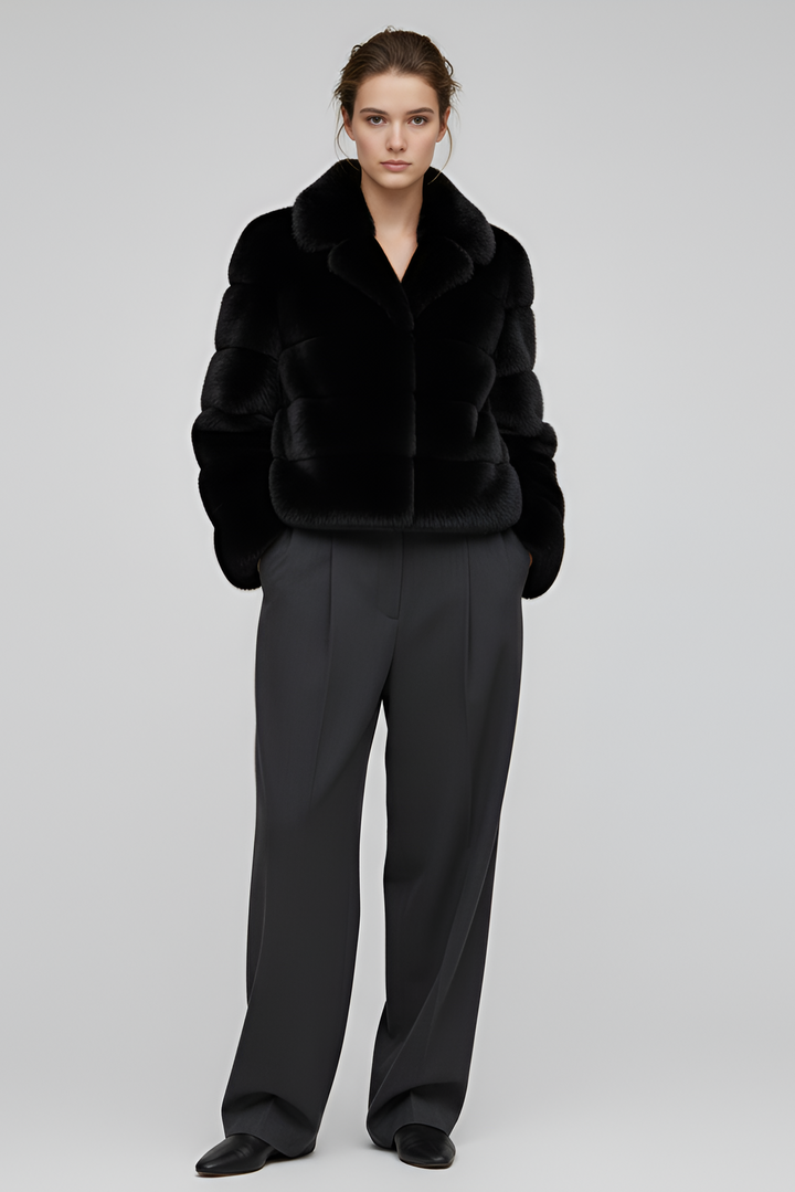 Soft faux fur texture shown in a close lifestyle view of the VELARIE coat.