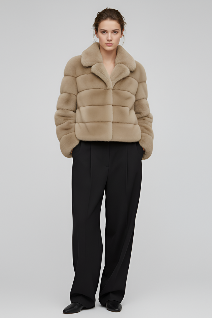 Side angle of the VELARIE faux fur coat highlighting its elegant silhouette.