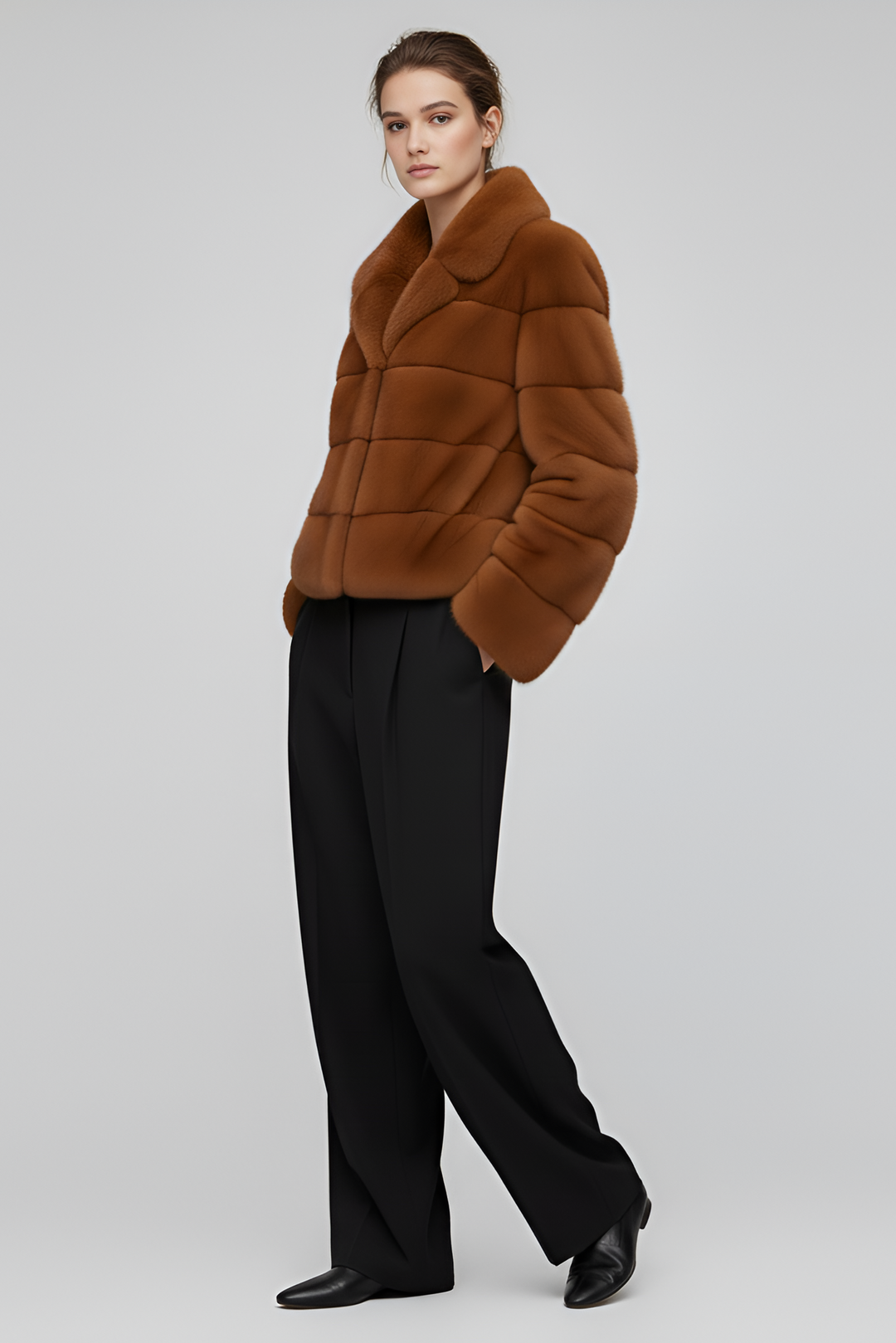 Model wearing the VELARIE faux fur coat in a winter outdoor setting.