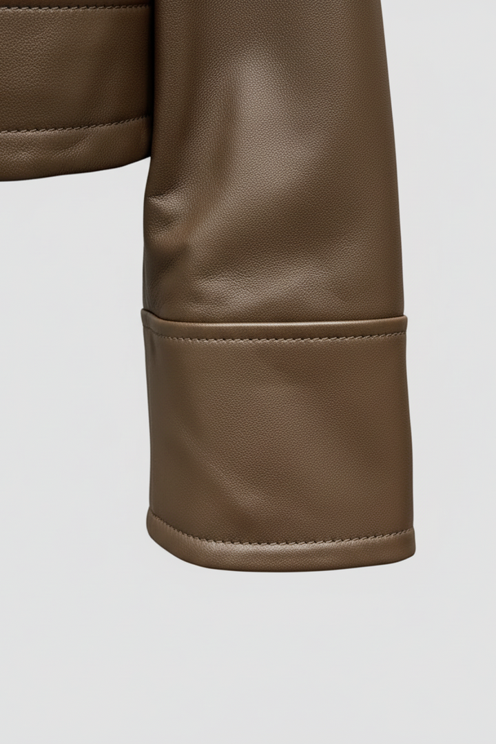 WAVERLY - Close-up of brown leather jacket sleeve and cuff detail
