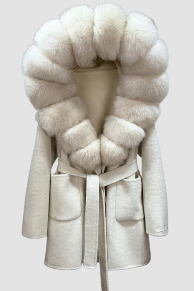 White coat with fur collar on a mannequin against a white background