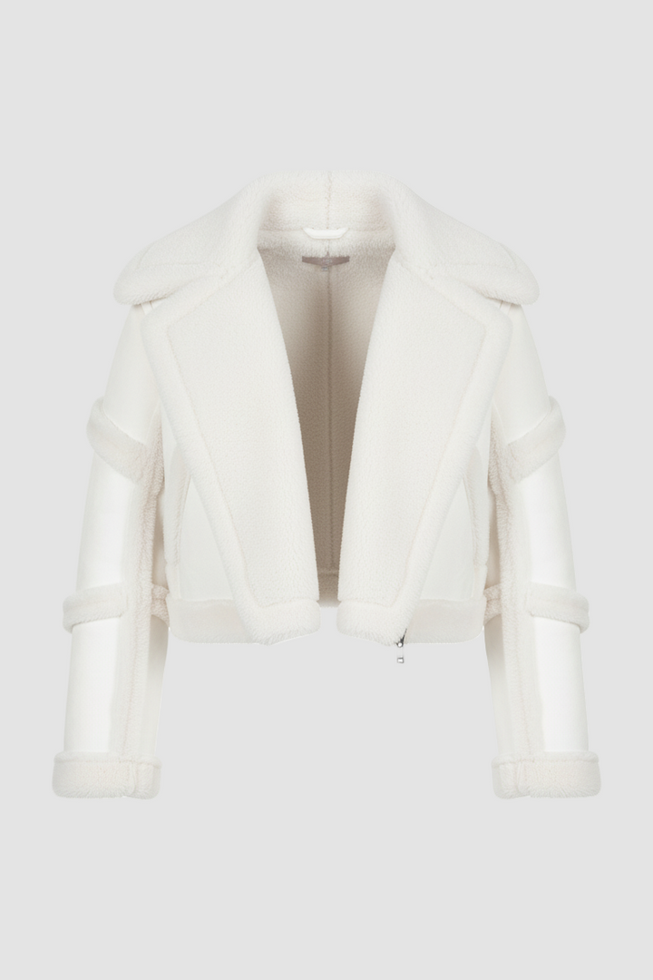 White fur coat on a mannequin against a white background