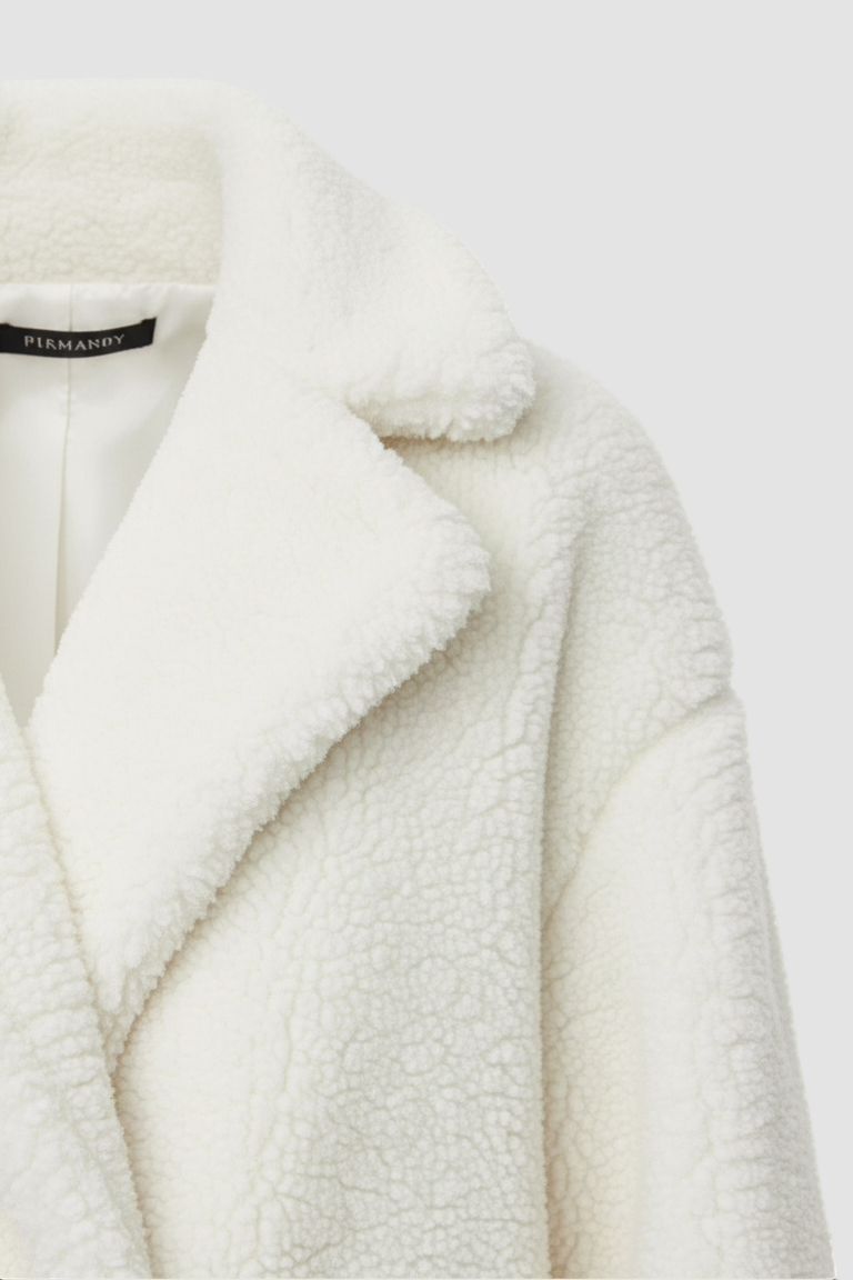 White fur coat with a brand label on a white background