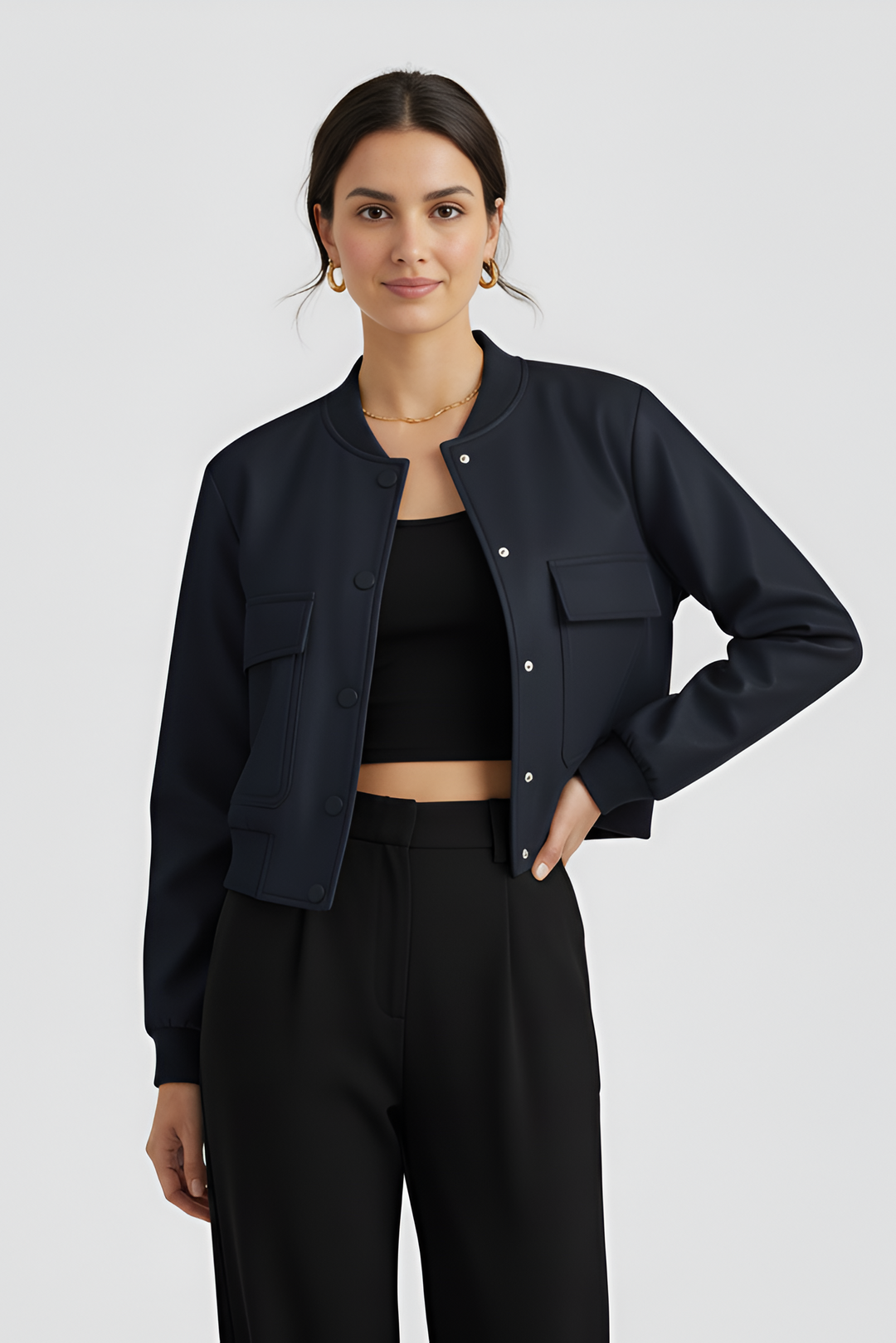 Woman wearing a black jacket and pants on a white background