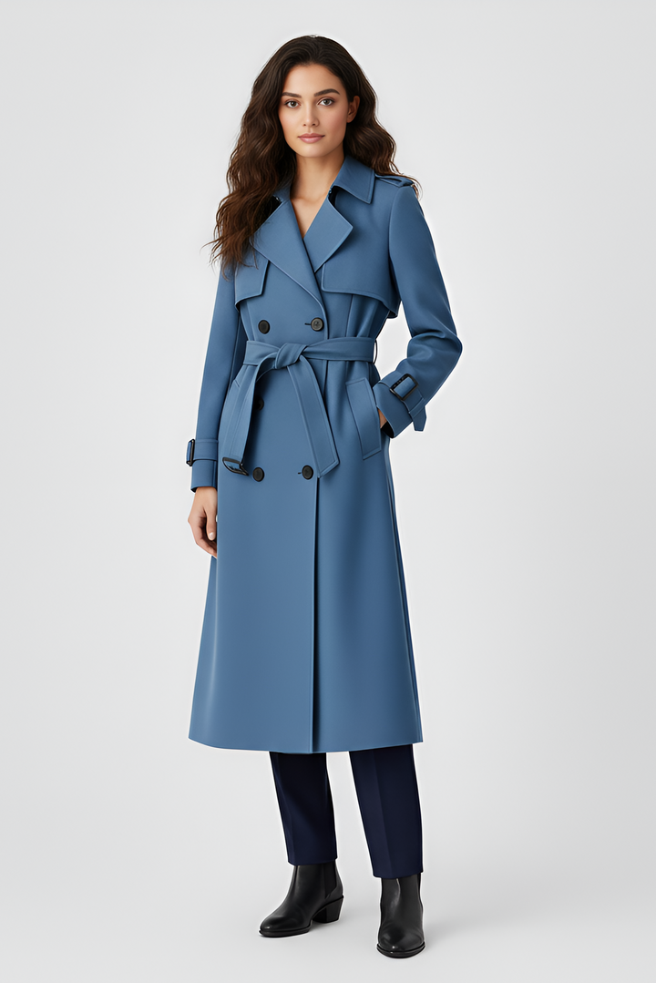 Woman wearing a blue trench coat on a white background
