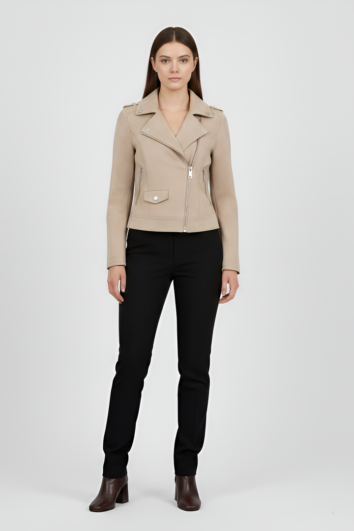 Woman wearing a beige jacket and black pants on a white background