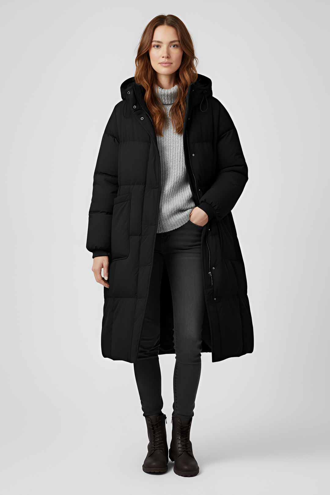 Woman wearing a black coat on a white background