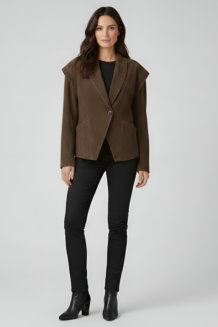 Woman wearing a brown jacket and black pants on a white background