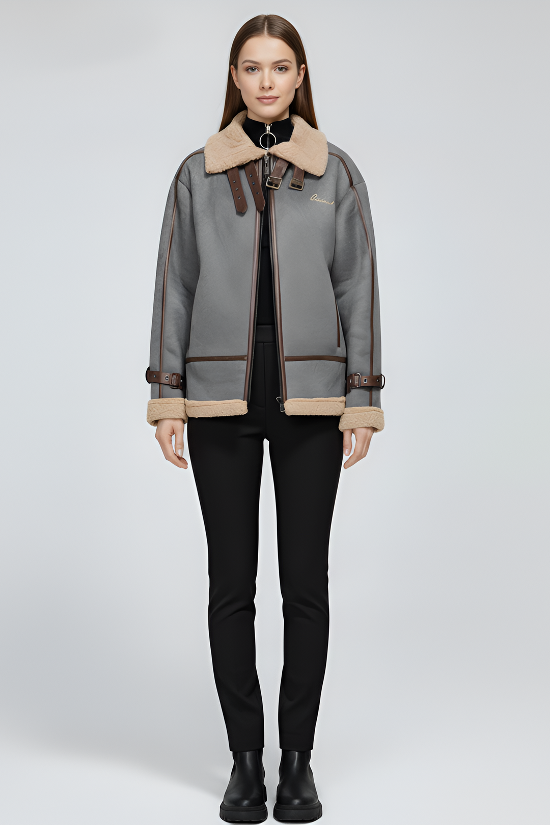 Woman wearing a gray jacket with beige accents on a white background