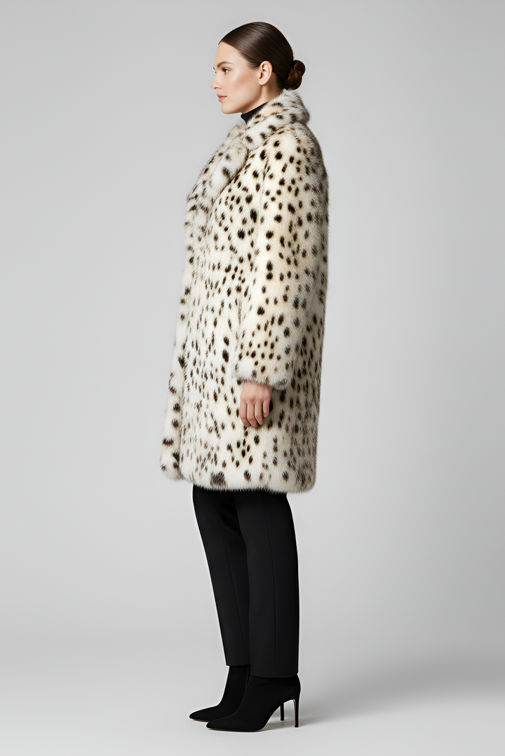 Woman styling the LEOVARA leopard coat with a winter outfit.