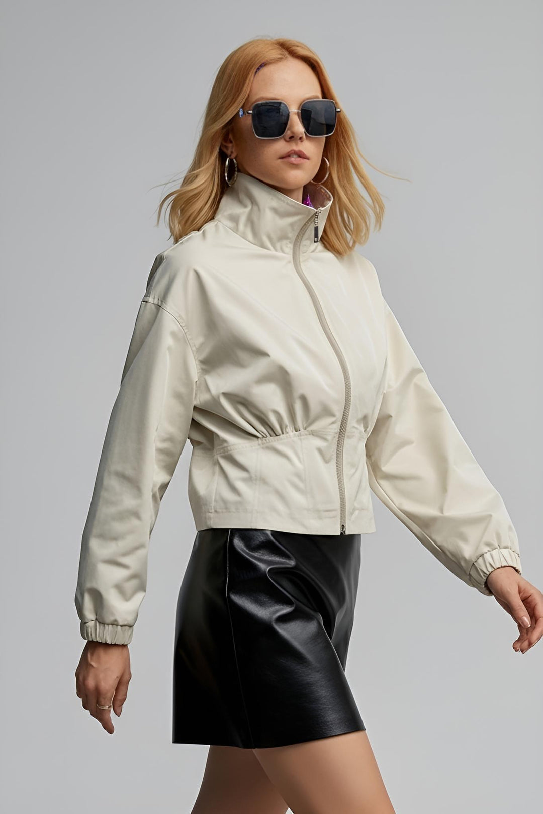 Woman walking in MAELIN beige jacket side pose