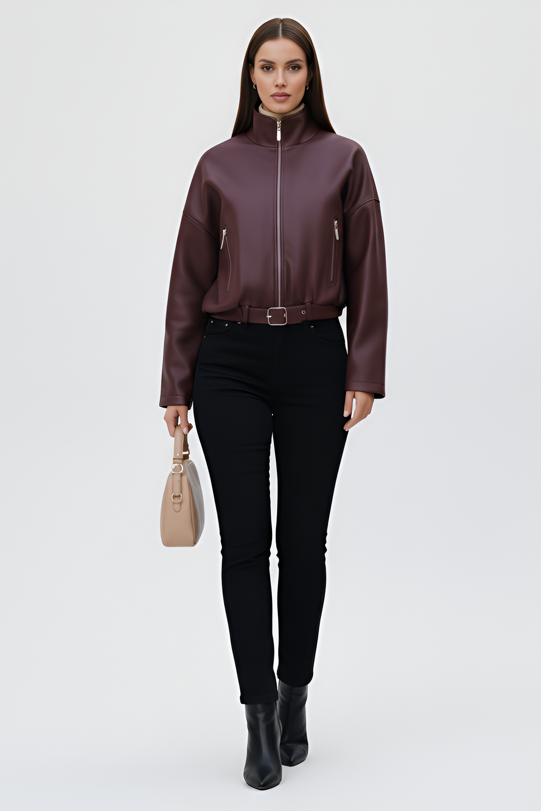 Woman wearing AVELON Faux Leather Bomber Jacket in burgundy with funnel neck and zip front.
