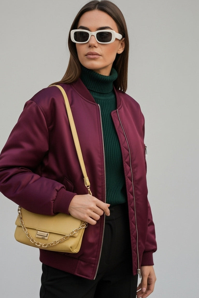 Woman wearing LYRIEL Purple Puffer Bomber Jacket with baseball collar and zip-front closure.
