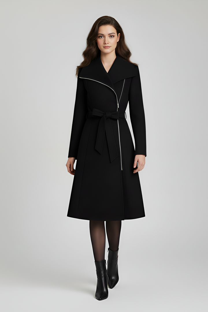 Woman wearing a black coat on a white background
