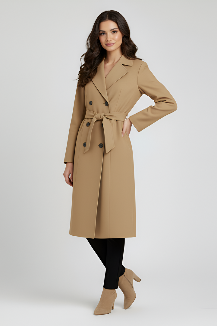 Woman wearing a beige trench coat on a white background