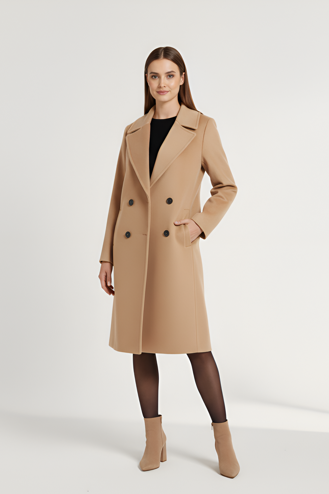 Woman wearing a beige coat on a white background