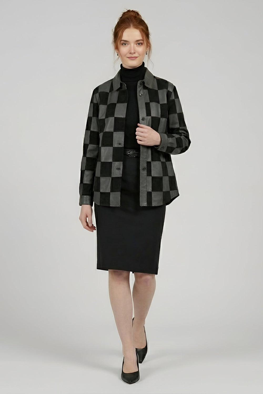 Woman wearing a black and gray checkered jacket with a black skirt on a white background