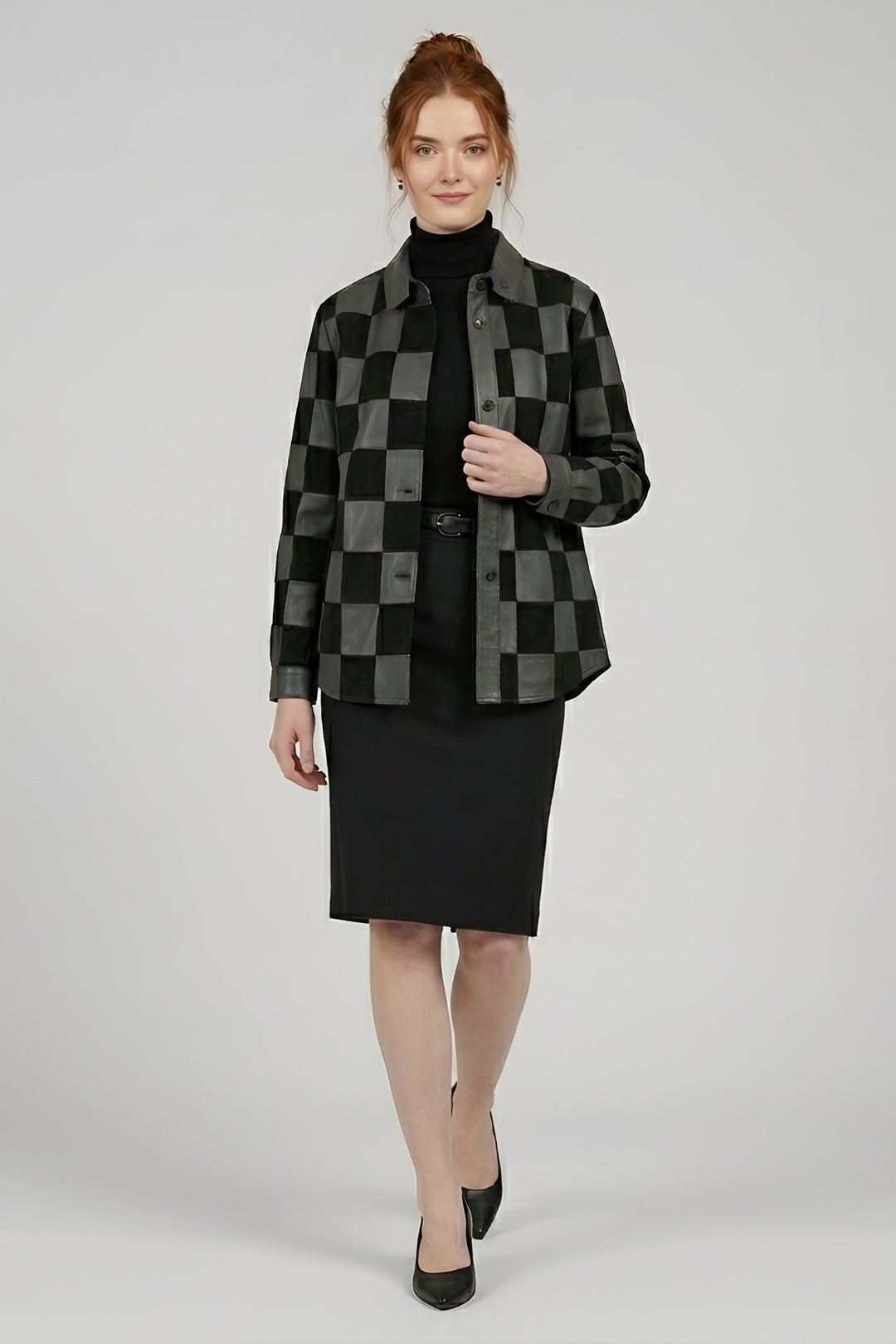 Woman wearing a black and gray checkered jacket with a black skirt on a white background