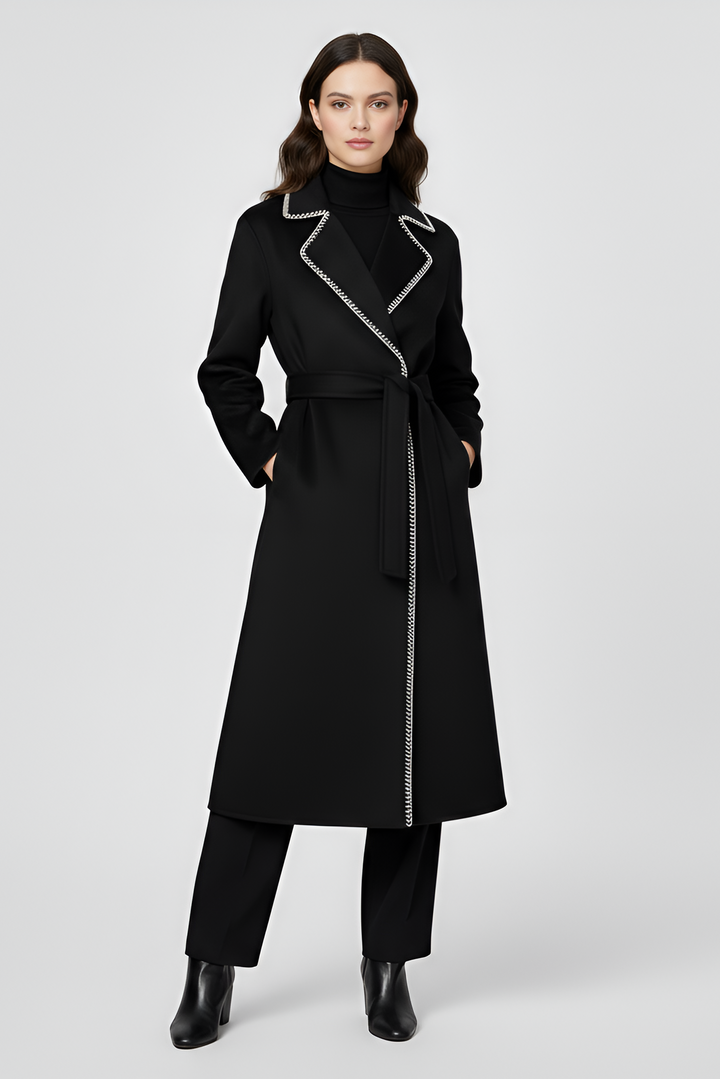 Woman wearing a black coat with silver zipper on a white background