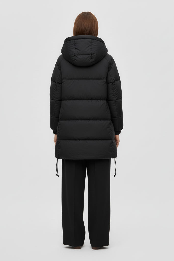 Woman wearing a black puffer coat on a white background