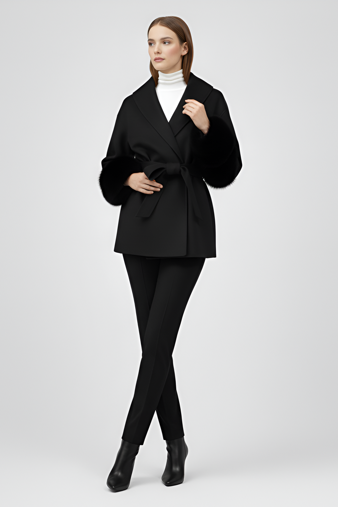Woman wearing a black suit on a white background