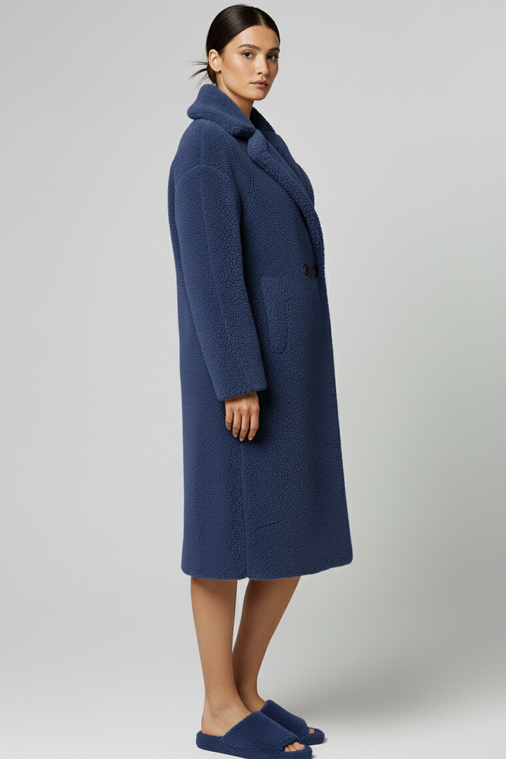 Woman wearing a blue coat on a white background