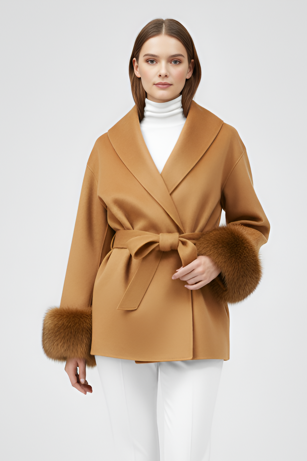 Woman wearing a brown coat with fur trim on a white background