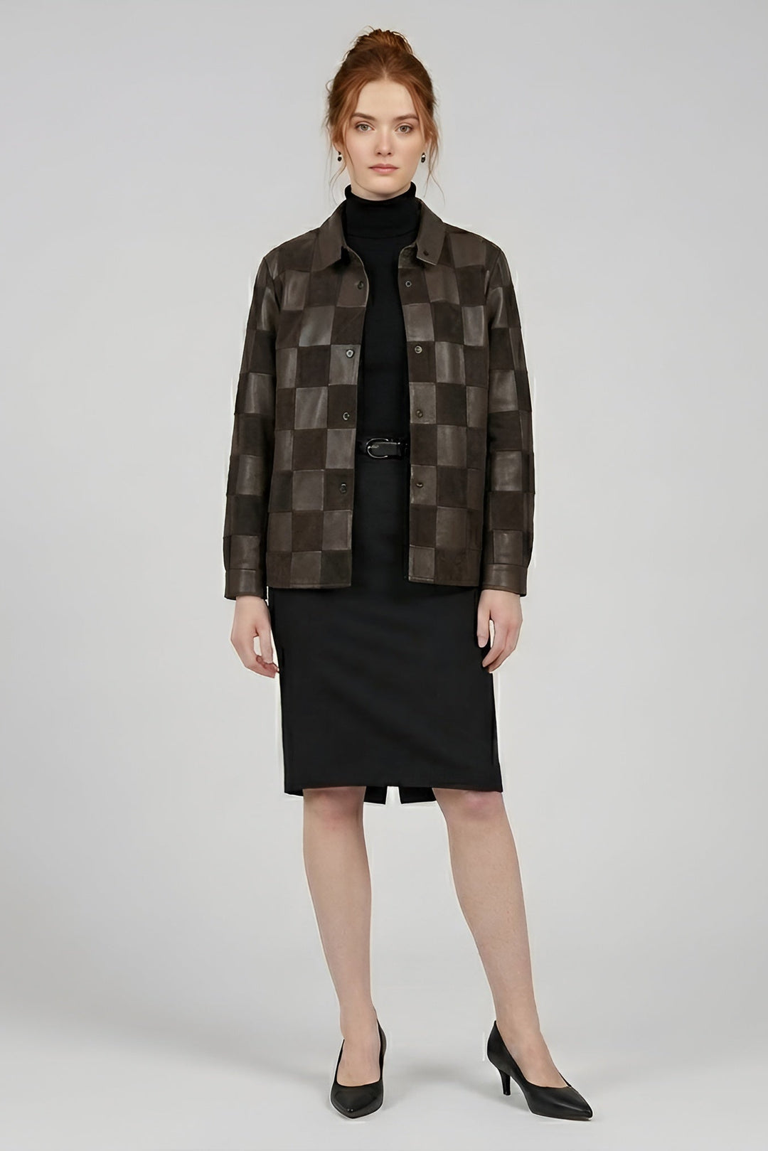 Woman wearing a checkered brown jacket over a black outfit on a white background