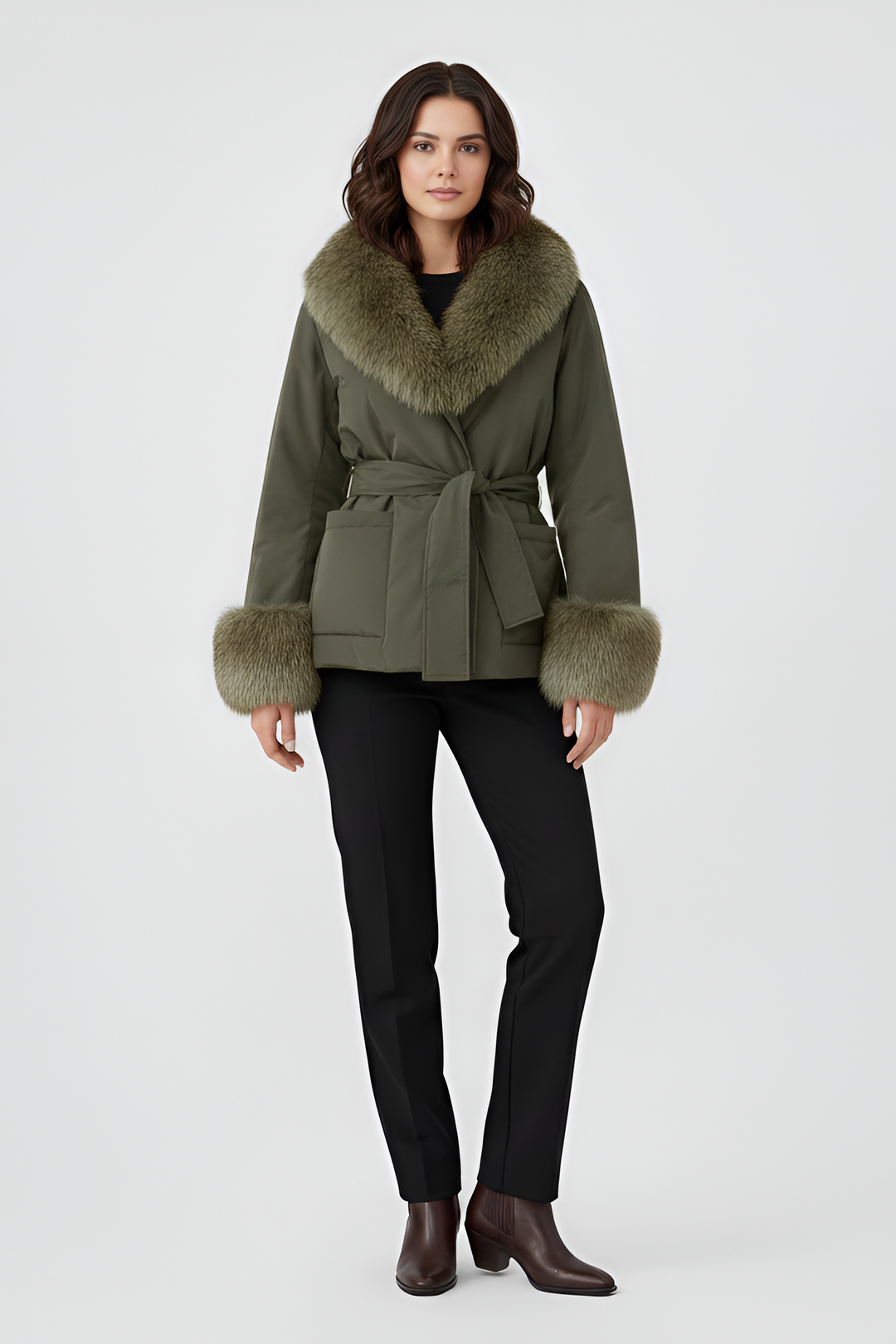 Woman wearing a green coat with fur trim on a white background
