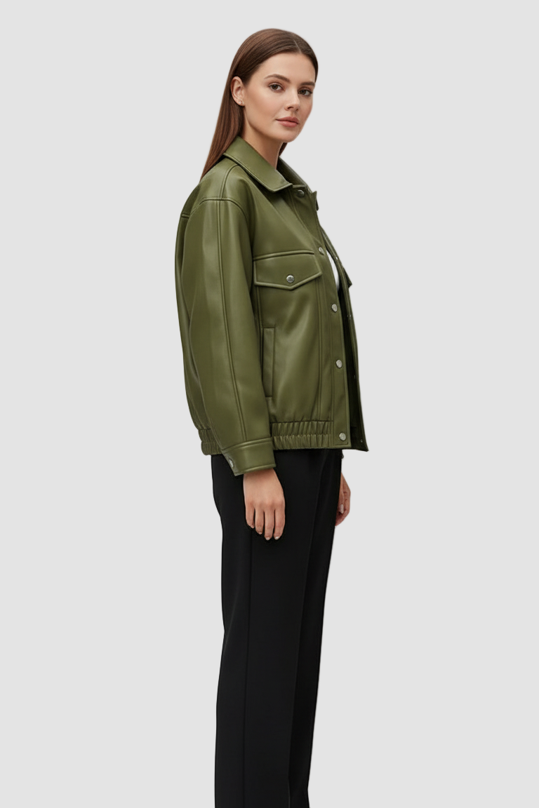 Woman wearing a green jacket and black pants on a white background
