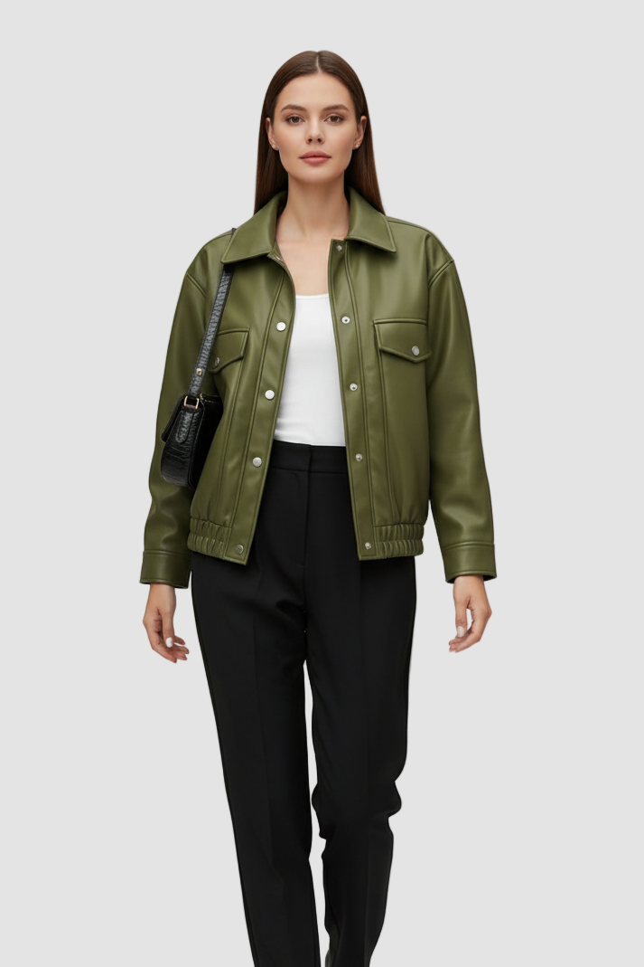 Woman wearing a green jacket, white top, black pants, and black shoes on a white background